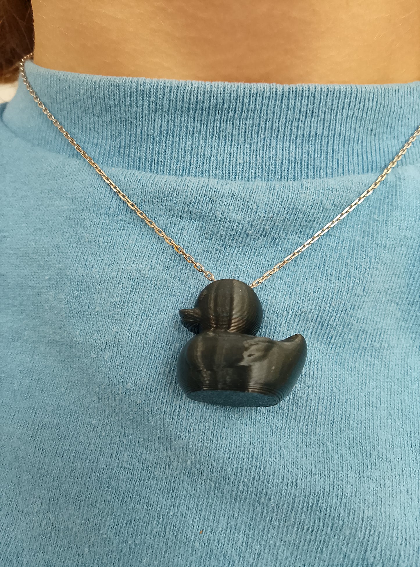 Who gives a duck necklace